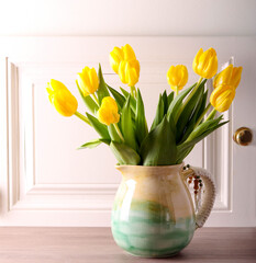 tulips in ceramic jar