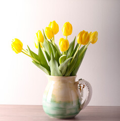  tulips in ceramic jar