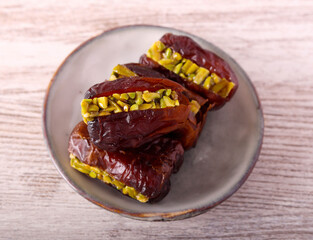 Date with pistachio filling on plate
