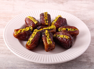 Date with pistachio filling on plate