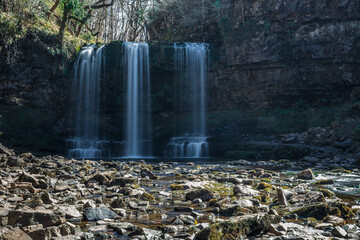 Sgwd yr Eira waterfall in Brecon Beacons national park, south Wales, famous for being the falls behind which you can walk