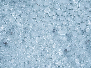 Aerial top down view of unique pancake ice formations on the Baltic Sea surface in Estonia during cold winter day.