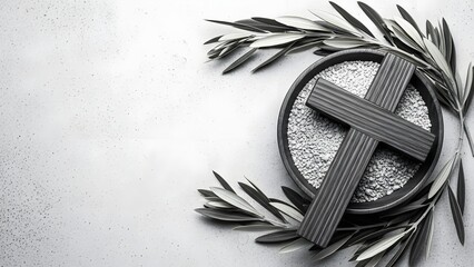 Black whisk symbol surrounded by olive branches and seeds on a light background