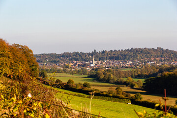 Autumn view of Dorking market town with church spire and Surrey Hills countryside, England © Harry Green