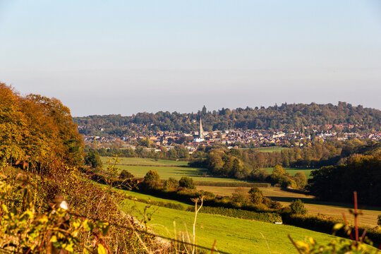 Autumn view of Dorking market town with church spire and Surrey Hills countryside, England