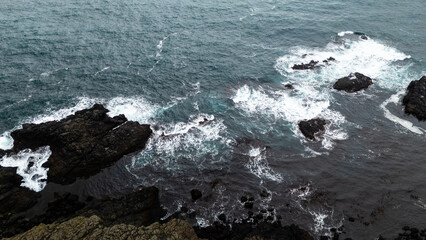 Iceland -View of rugged coastline and rough sea