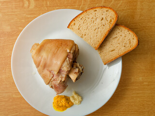 Cooked pork knuckle on plate top view