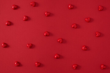 Small hearts on a red background