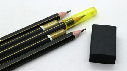 Black wooden pencils on white background