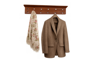 Cozy wool coat and floral scarf hanging on a wooden coat rack, ready for autumn and winter fashion