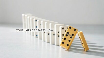 A single golden domino stands out in a falling chain reaction of white dominoes on a clean surface