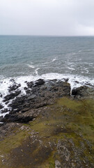 Iceland -View of rugged coastline and rough sea