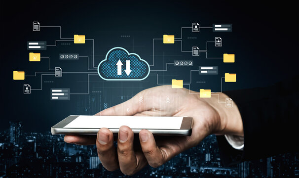 A hand holds a smartphone displaying a cloud storage interface, symbolizing data transfer and document management in a modern business context. Gantry - Powered by Adobe