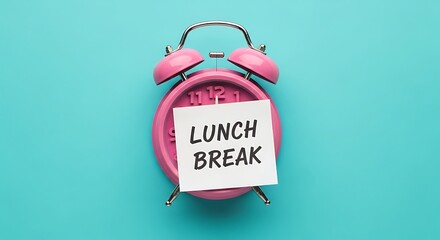 Pink alarm clock displaying a handwritten sticky note indicating it is officially time for lunch break