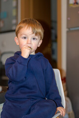 Toddler Eating Snack Indoors Portrait