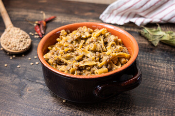 Pasta and lentils served on a ceramic bowl. Mediterranean food naturally vegan.