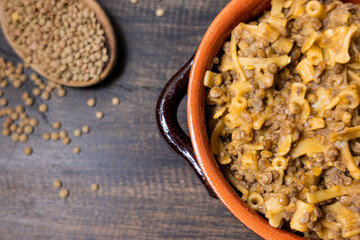 Pasta and lentils served on a ceramic bowl. Mediterranean food naturally vegan.