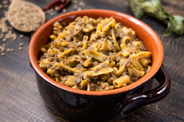 Pasta and lentils served on a ceramic bowl. Mediterranean food naturally vegan.