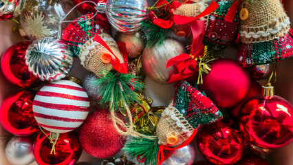 Box filled with colorful Christmas ornaments and decorations