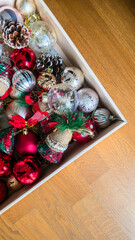 Box filled with colorful Christmas ornaments and decorations