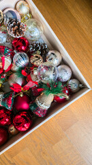 Box filled with colorful Christmas ornaments and decorations
