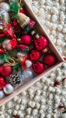 Box filled with colorful Christmas ornaments and decorations