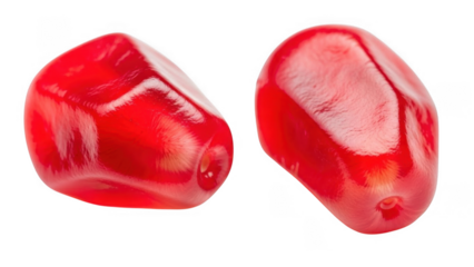 Two bright red pomegranate halves