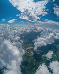 Naklejka premium Aerial cloudscape panoramic skydiving scene expansive countryside under dramatic sky high altitude adventure freedom thrill