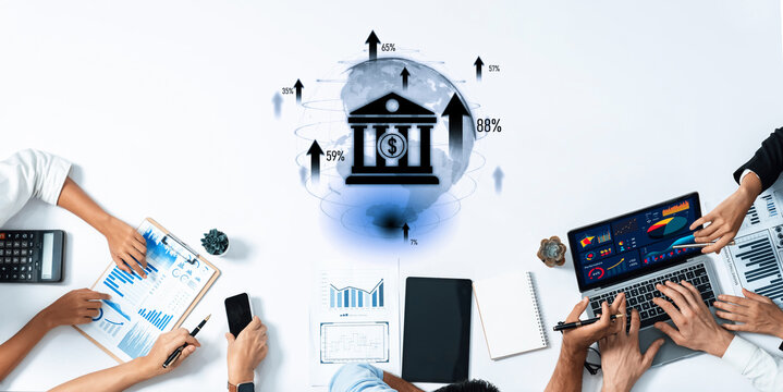 Team of professionals collaborates in a business meeting focused on financial analysis and strategic planning using technology and visual data representations. Trope - Powered by Adobe