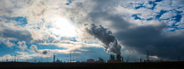 Industrial factory emitting smoke pollution into the atmosphere