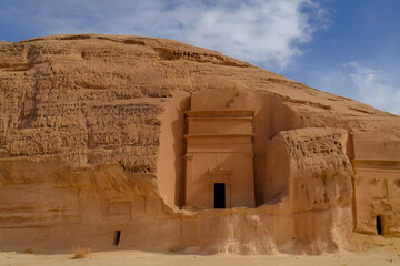 "Majestic Nabataean tomb facade carved in a sandstone mountain, Hegra, AlUla, Saudi Arabia, digital art illustration"