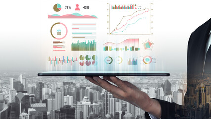 A businessman showcases a laptop displaying dynamic data analytics graphics, set against a vibrant city skyline, symbolizing business success and innovation. Impute