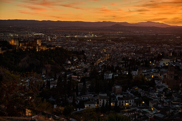 Naklejka premium Panoramic night view of the Alhambra and Granada city from San Miguel Alto viewpoint