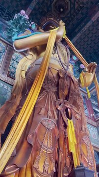 Tall Buddha statue in  temple in the Forbidden City in Beijing