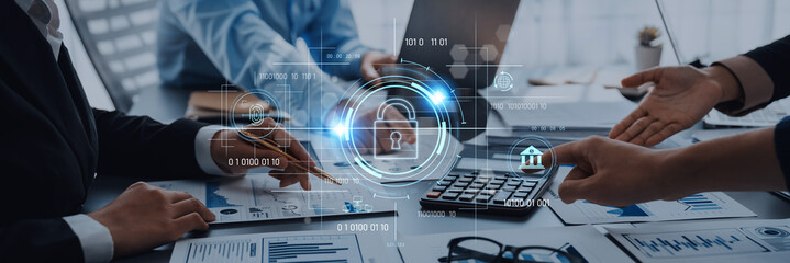 A dynamic business team collaborates in a modern office setting focused on security data and financial analysis, utilizing advanced technology and engaging discussions. Trope