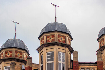 Beautiful Oxford architecture. An old brick building with domes on Worcester Street. Street photography of Oxford on a cloudy winter day.
