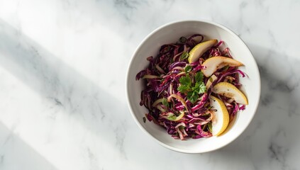 Colorful cabbage salad with herbs and pears on a marble surface, highlighting healthy diet choices, International Nutrition Week