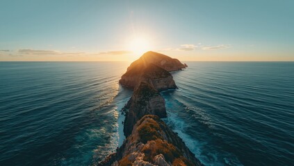Wide-angle view of a tranquil seascape at sunrise, highlighting erosion risk along the rocky coast