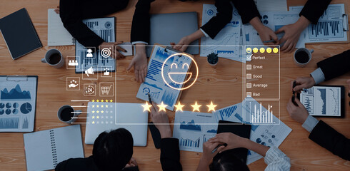 A business team collaborates on data analysis during a meeting, surrounded by charts and graphs. A digital overlay showcases positive feedback symbols, emphasizing success. Trope