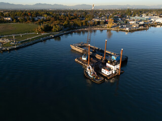 Obraz premium Drone view of Dredger in the river