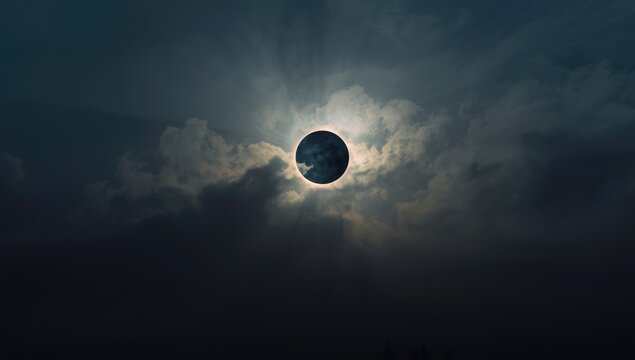 Cloudy sky during an eclipse, useful as a weather-themed UI background, Earth Day