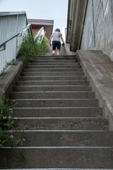 woman walking down stairs