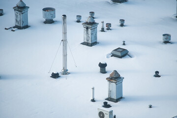 view of the roof of the building in winter, evenly covered with snow © ogikk