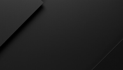 Minimalist dark paper background with a matte finish serving as an elegant backdrop for design and typography
