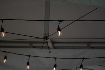 A lightbulb on wire in tent