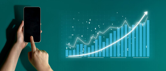 A hand interacts with a smartphone, revealing a dynamic financial graph, symbolizing modern business growth, digital innovation, and data-driven decision-making. Impute