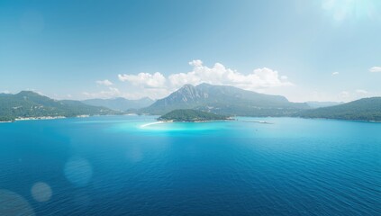 Obraz premium Sea and sky scene with mountain horizon, designed as a natural landscape backdrop