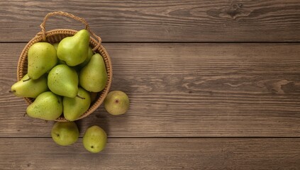 Green pears arranged in wicker basket on wooden table highlighting natural produce for health-conscious eating