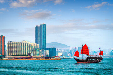 Hong Kong, China with a traditional junk boat in the harbor 4106