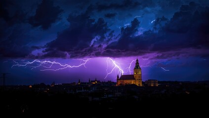 Night scene with a lightning strike over an urban area and church, highlighting weather phenomena